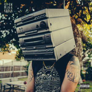 Album cover of Component System with the Auto Reverse. The image is of the torso of a person who has a shelf-stereo on their shoulders instead of a head.